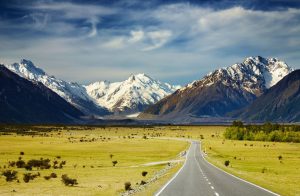 Visit-New-Zealand-Landscape-With-Road-and-Snowy-Mountains-Southern-Alps-New-Zealand-1600x1047